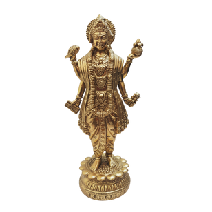 Golden Dhanvantri Ji statue on ornate pedestal