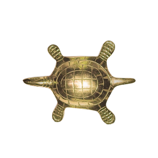 Golden turtle statue with round segmented shell