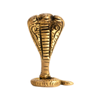 Gold-brass cobra snake figurine on a black background