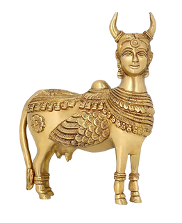 Golden Kamdhenu Cow statue with ornate decorative detailing