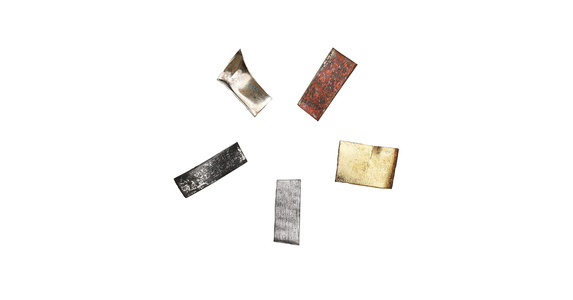 Five separate Panch Dhatu metal pieces on a white background