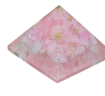 Soft pink Rose Quartz crystal pyramid with translucent facets