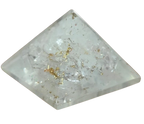 White translucent selenite pyramid with natural inclusions on a black background