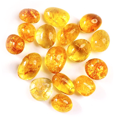 Citrine tumble stones in rounded translucent golden-yellow, honey, amber, and orange tones