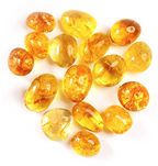 Citrine tumble stones in rounded translucent golden-yellow, honey, amber, and orange tones