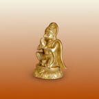 Garud Dev golden statue on a warm devotional studio background