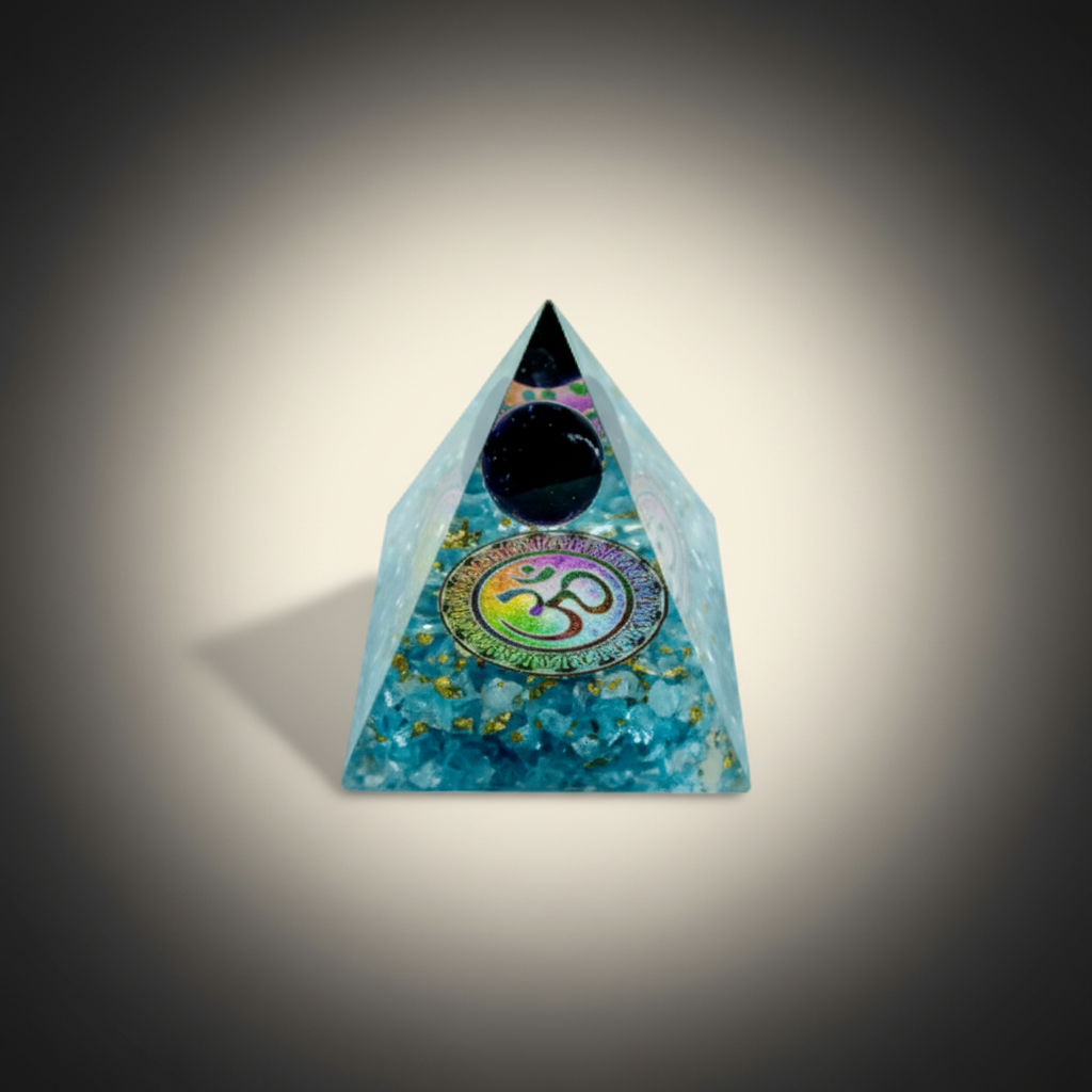 Black Tourmaline crystal pyramid with a central circular motif on a charcoal and ivory background