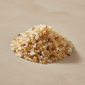 Citrine Crystal Chips arranged on a warm neutral stone surface