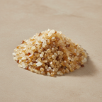 Citrine Crystal Chips arranged on a warm neutral stone surface