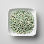 Prehnite crystal chips arranged in a white ceramic dish