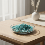 Blue Apatite tumbled stones displayed in a glass dish on a calm workspace