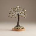 Pyrite crystal tree with metallic chips, dark branches, and a wood base on a neutral background