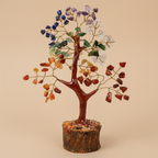 Close three-quarter view of a Seven Chakra crystal tree with colourful stones and branching trunk