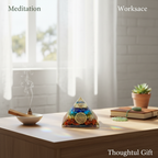 7 Chakra Yantra crystal pyramid displayed in a meditation and workspace setting