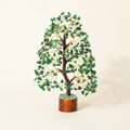 Green Aventurine crystal tree with green chips, golden branches, and a warm wood base on an ivory background