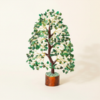 Green Aventurine crystal tree with green chips, golden branches, and a warm wood base on an ivory background
