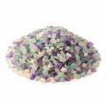 Close-up pile of Fluorite crystal chips on a light background