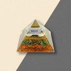Prosperity-themed Money Pyramid with layered decorative details on a premium studio background