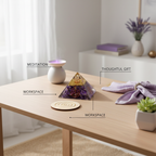 Amethyst crystal pyramid displayed in a meditation and workspace setting