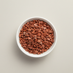 Red Jasper crystal chips arranged in a white ceramic dish