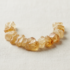 Close-up of rough golden-yellow and honey Citrine Crystal Chips