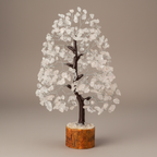 Close three-quarter view of a Clear Quartz crystal tree with translucent chips and dark branches