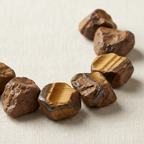 Close-up of rough golden-brown and honey Tiger Eye Crystal Chips