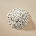 Howlite Crystal Chips arranged on a warm neutral stone surface