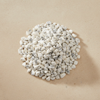 Howlite Crystal Chips arranged on a warm neutral stone surface