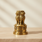 Brass Ashoka Stambh-inspired decor displayed on a warm neutral surface