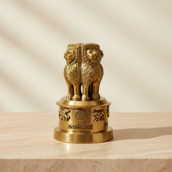 Brass Ashoka Stambh-inspired decor displayed on a warm neutral surface