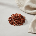 Red Jasper crystal chips arranged with neutral linen décor