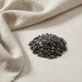 Hematite crystal chips arranged with neutral linen décor