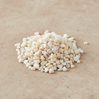 Calcite Crystal Chips arranged on a warm neutral stone surface