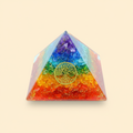 Colorful 7 Chakra Orgone Tree pyramid with central tree motif on a warm ivory background