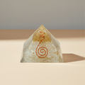 Pale white Selenite crystal pyramid on a soft premium studio background