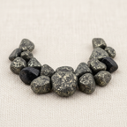 Close-up of rough dark metallic gray and silver-gray Pyrite Crystal Chips