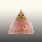Pink crystal pyramid with a gold top detail and copper spiral on a premium studio background