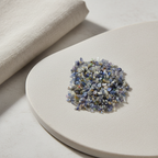 Blue Sapphire crystal chips arranged with neutral linen décor