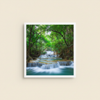 WATERFALL forest landscape poster displayed on a warm ivory studio background