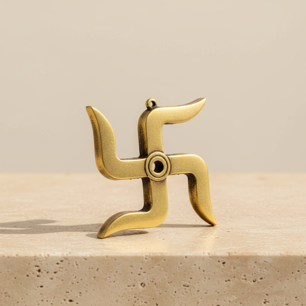 Gold-brass Swastik decor displayed on a warm neutral surface