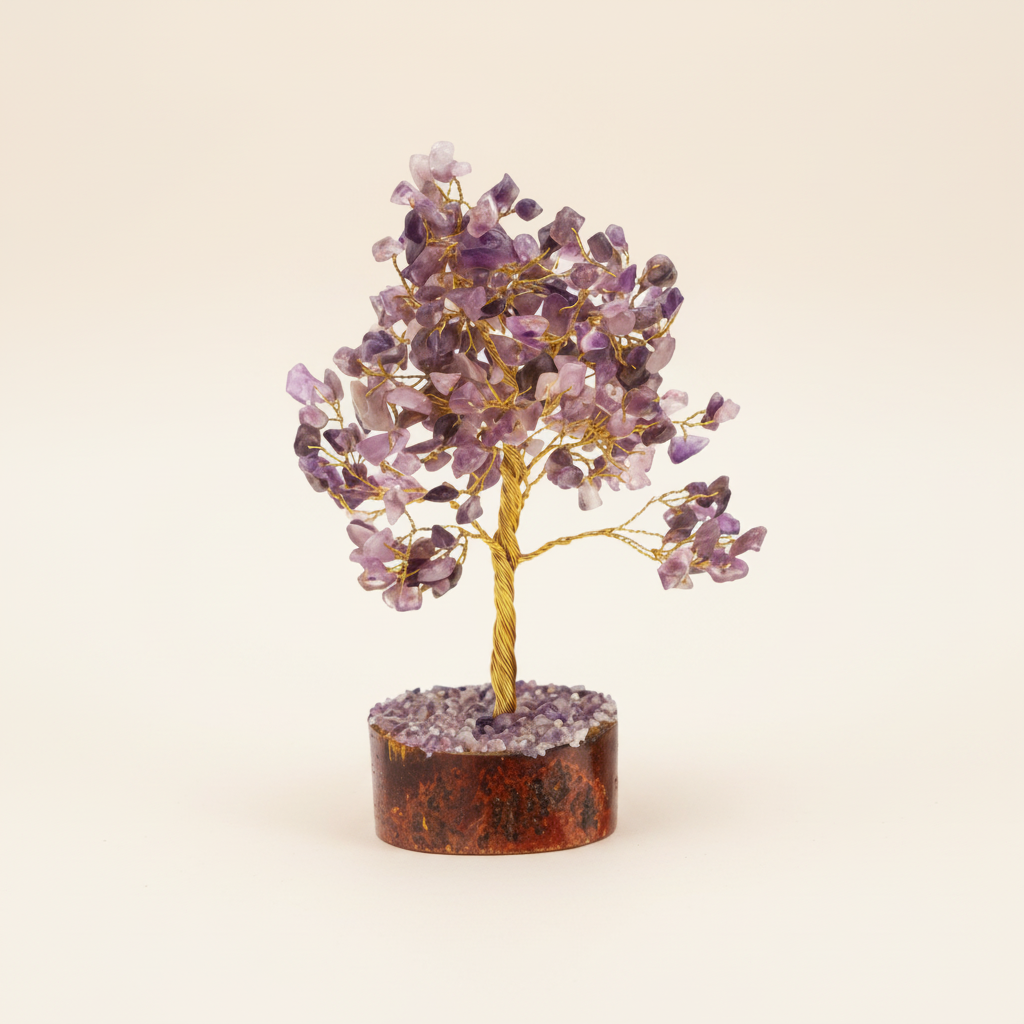 Amethyst crystal tree with purple chips, golden branches, and wood base on an ivory background