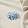 Angelite crystal chips arranged with neutral linen décor