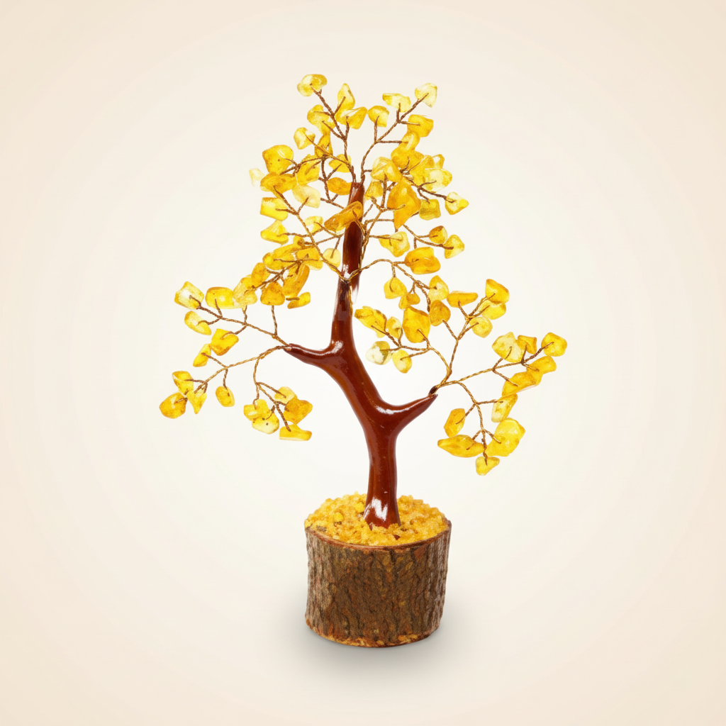 Citrine crystal tree with golden chips on a warm ivory background