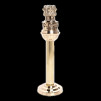 Tall brass Ashoka Pillar-inspired decor on a plain black background