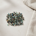 Azurite crystal chips arranged with neutral linen décor