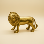 Golden lion statue in a warm studio setting, front three-quarter view