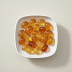 Citrine tumble stones arranged in a white ceramic dish