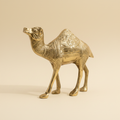 Golden camel statue front three-quarter view