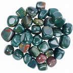 Close-up arrangement of Bloodstone tumble stones on a light background